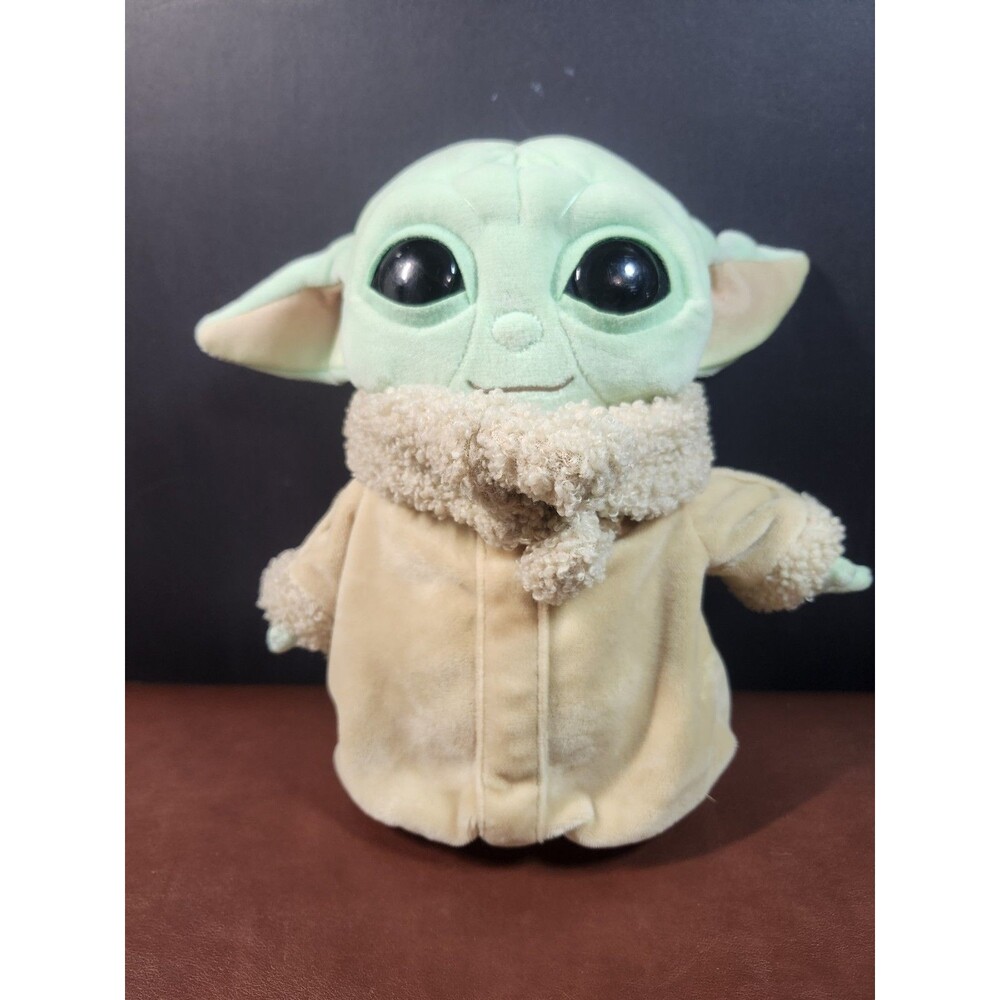 Mattel Star Wars The Mandalorian The Child featuring a soft beige robe with...